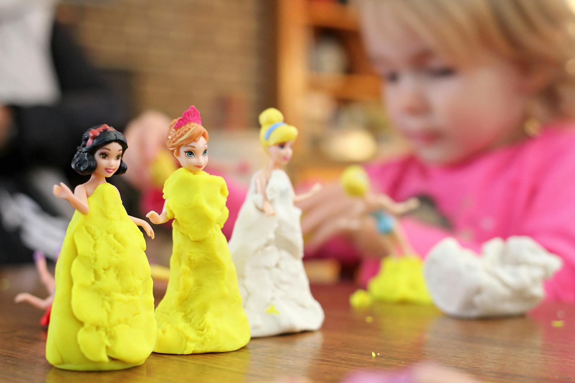 Play-based therapy session featuring Play-Doh modelling and dolls in occupational therapy session in London, Ontario