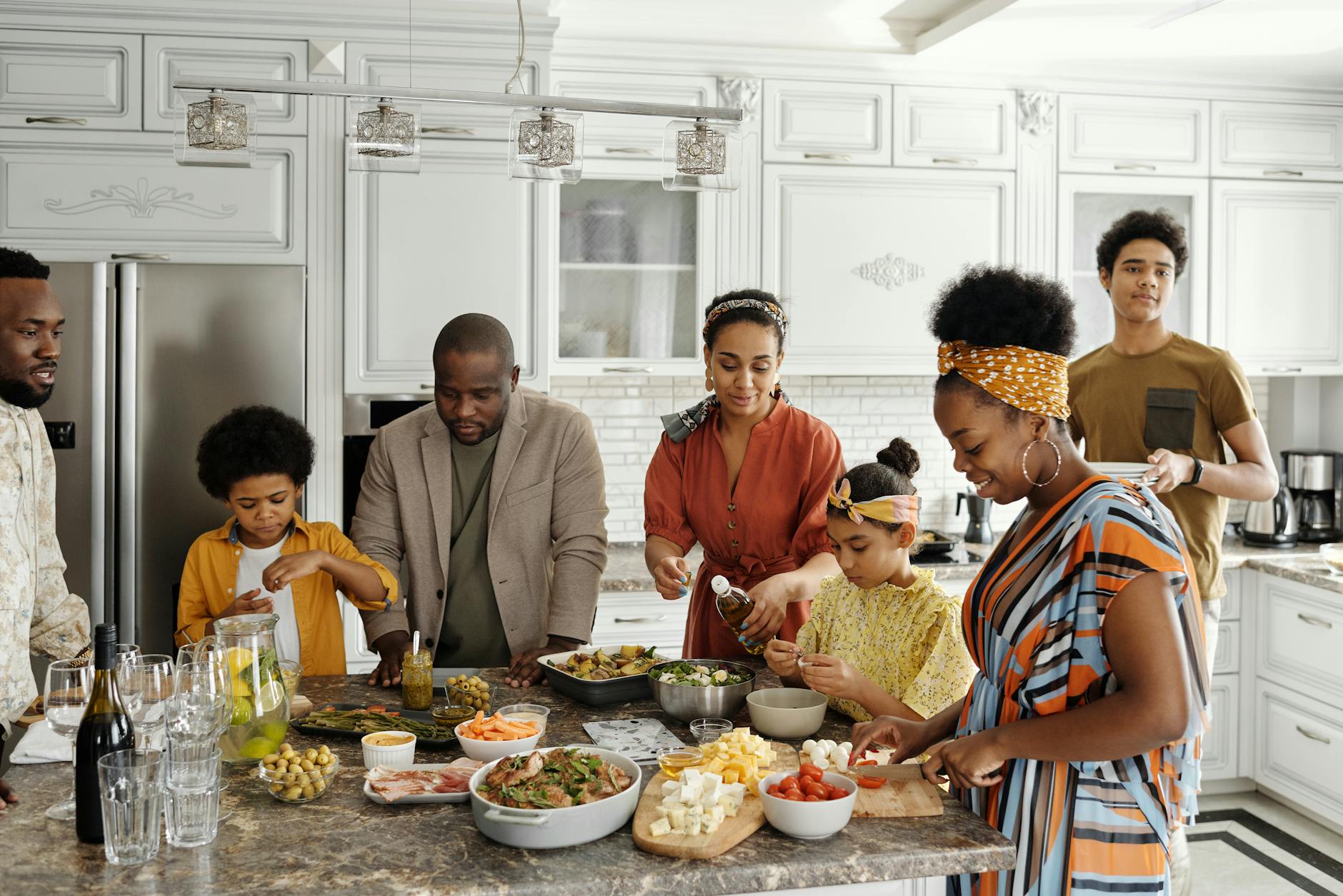 family gathered around meal time, emphasizing importance of family-centred care in occupational therapy, services offered in London, Ontario